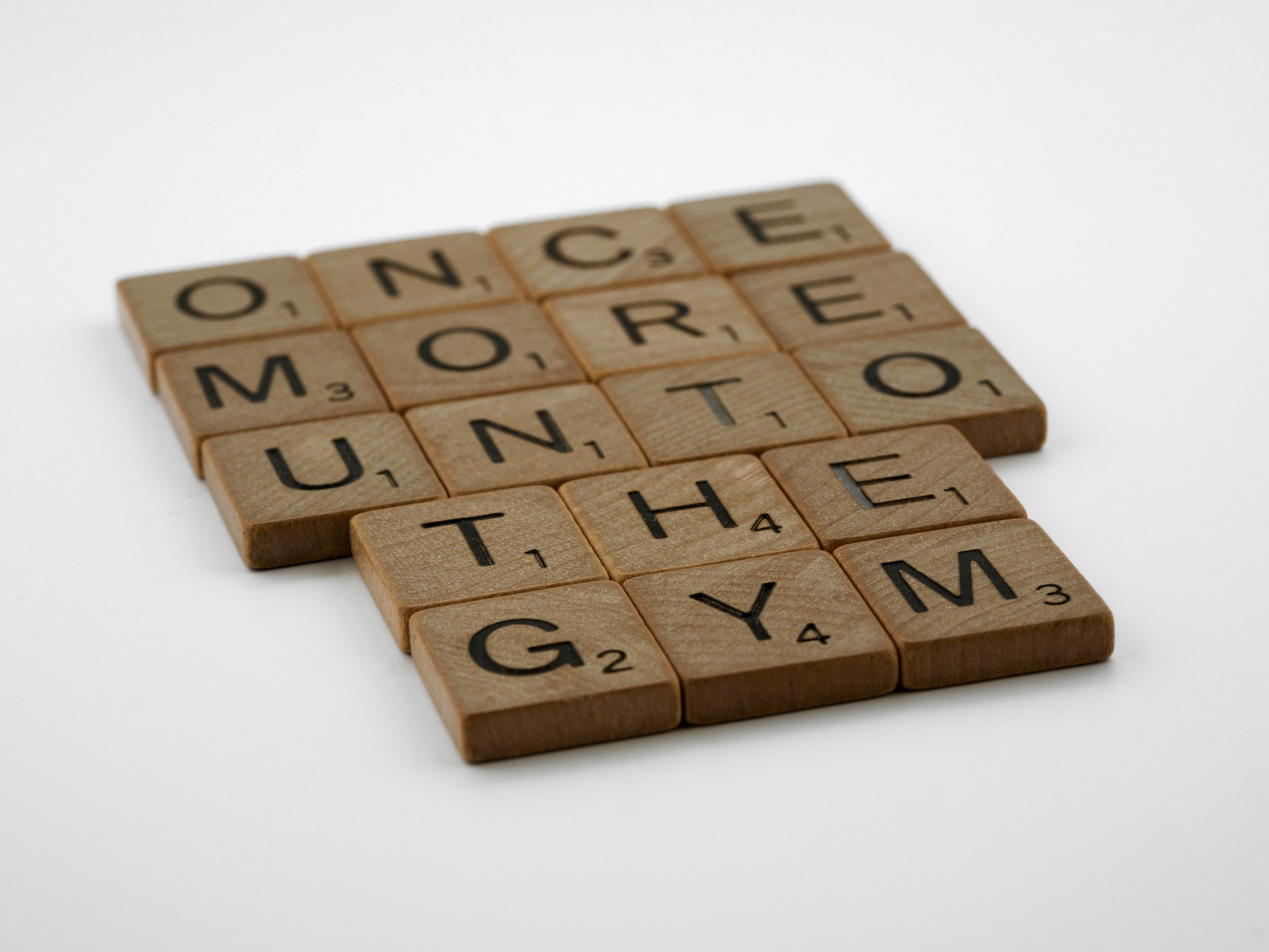 Scrabble pieces spelling out 'once more unto the gym'